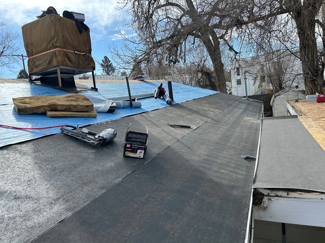 New underlayment and synthetic felt installed over roof decking on a Littleton, Colorado home