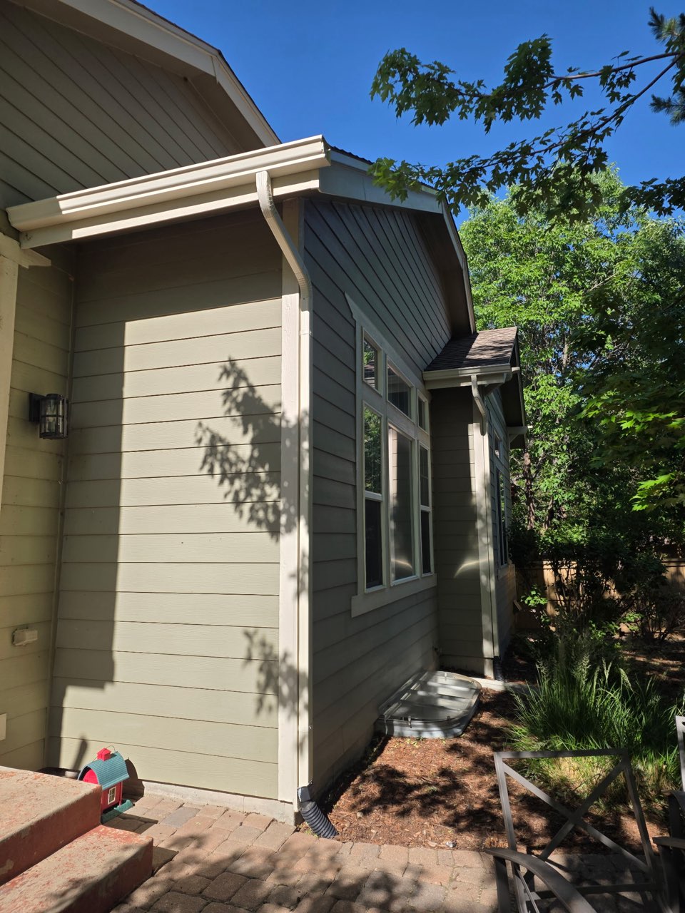 Seamless gutter and downspout installed on a Colorado home to prevent water damage
